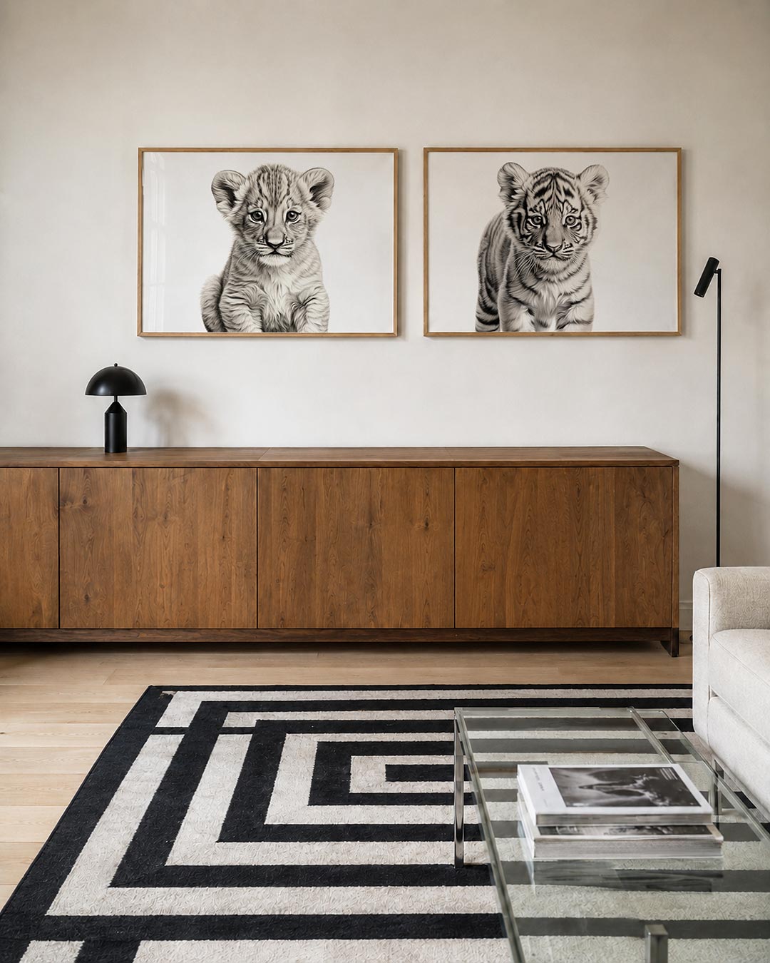 Twee liggende posters met donkere tinten en een rustige visuele opbouw, aan de muur in een interieur