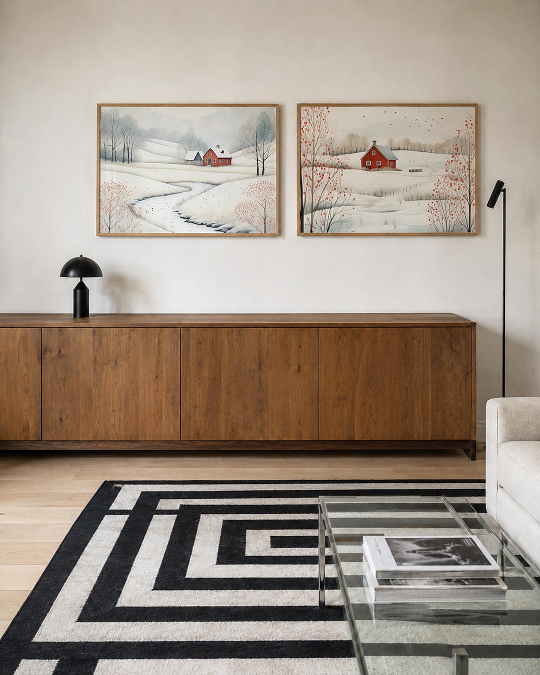 Tweedelige posterset met een vredig winterlandschap met een rode boerderij, getoond in een interieur