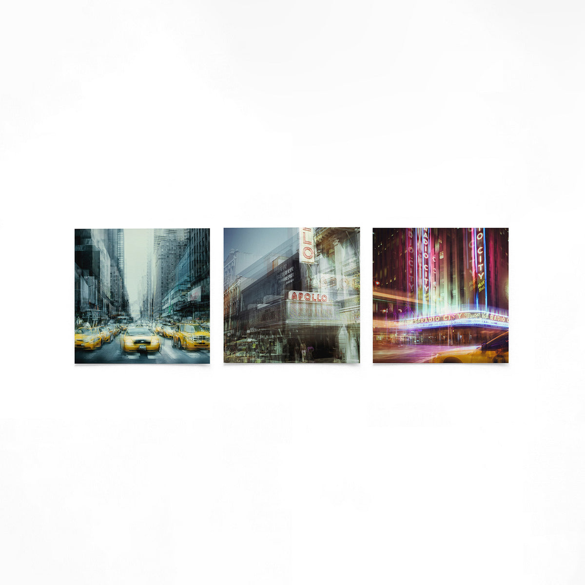 Productfoto van drie vierkante posters met stadslicht en gevels – Gerald Emming